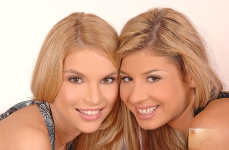 Look-alikes Summer and Victoria Tiffani play with each other's muff in nylons