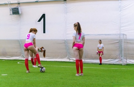 Skinny teen soccer players undressing and rubbing each other's muffs