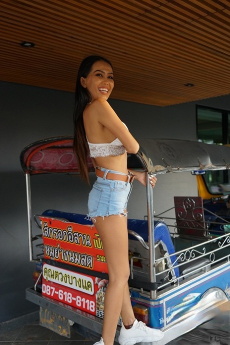 Sweet Asian babe Noki shows off her firm fake tits and gets banged hard
