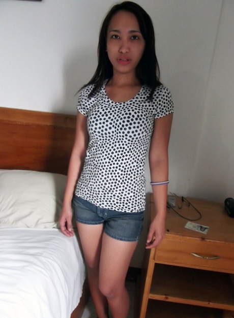 Dirty Asian teen Caren Olimberio doffs her clothes and rides a stiff rod