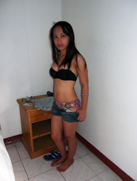 Dirty Asian teen Caren Olimberio doffs her clothes and rides a stiff rod