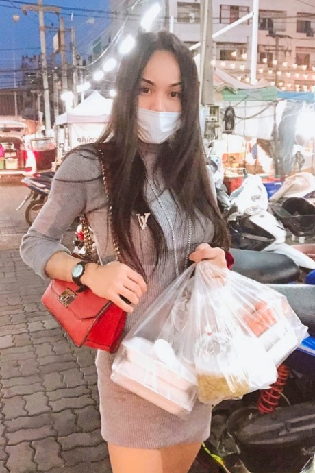 Sexy Asian shemale shows off her perfect body in pretty outfits