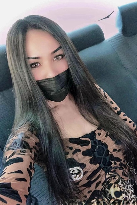 Sexy Asian shemale shows off her perfect body in pretty outfits