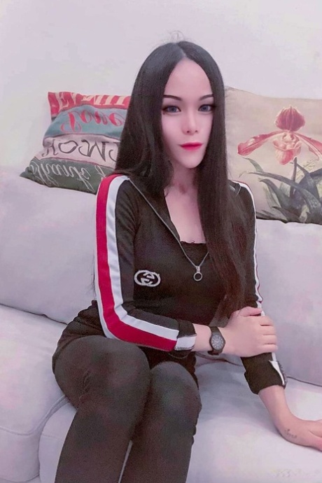 Sexy Asian shemale shows off her perfect body in pretty outfits