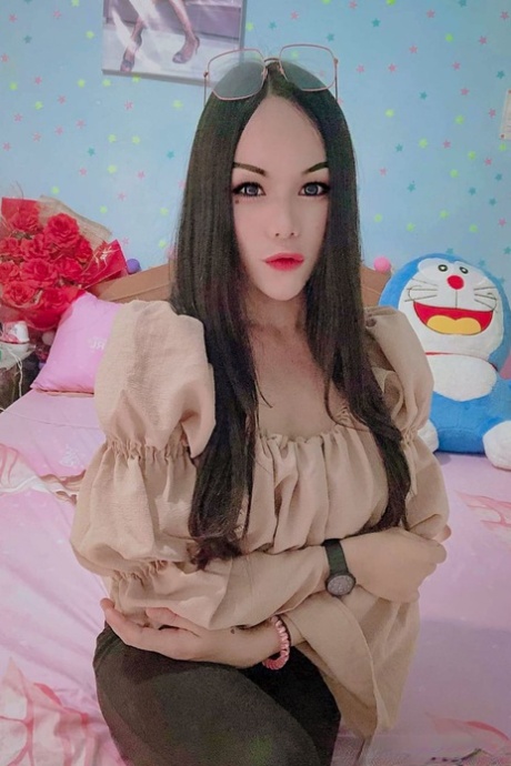 Sexy Asian shemale shows off her perfect body in pretty outfits