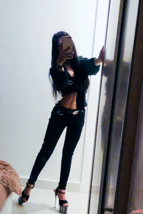 Sexy Asian shemale shows off her perfect body in pretty outfits
