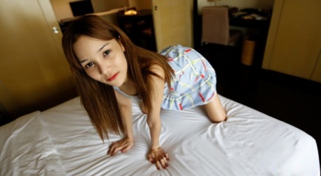 Beautiful Asian shemale flashes her perfect tits in a sexy dress