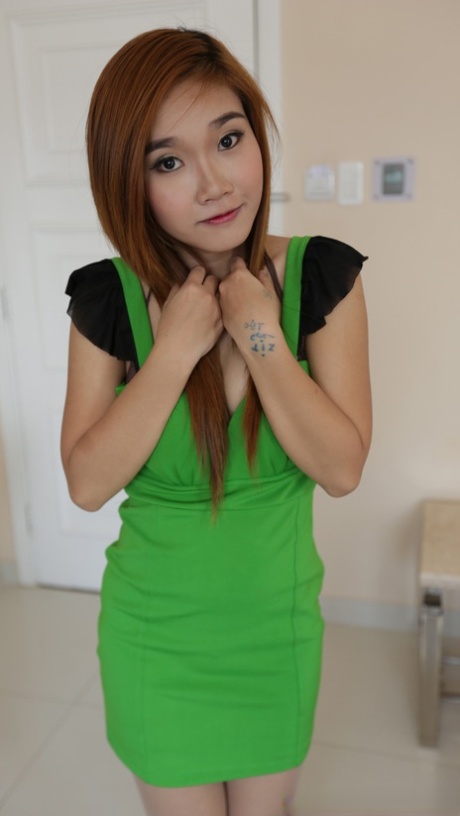 Sexy Asian babe Dao shows off her big ass & her pretty trimmed pussy