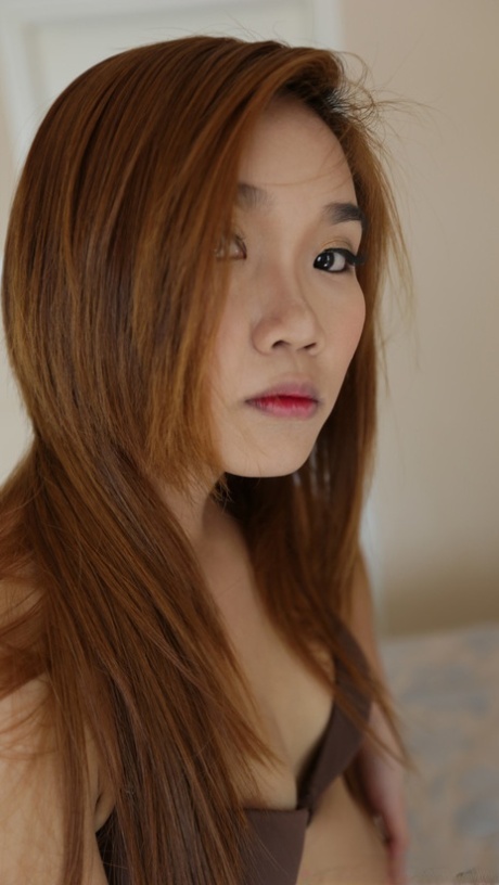 Sexy Asian babe Dao shows off her big ass & her pretty trimmed pussy