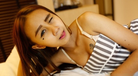 Small titted skinny Asian teen Puy B undresses and takes a cock in POV