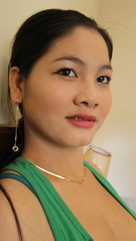 Chubby Thai girl Nga shows her big tits and spreads her legs for a cock