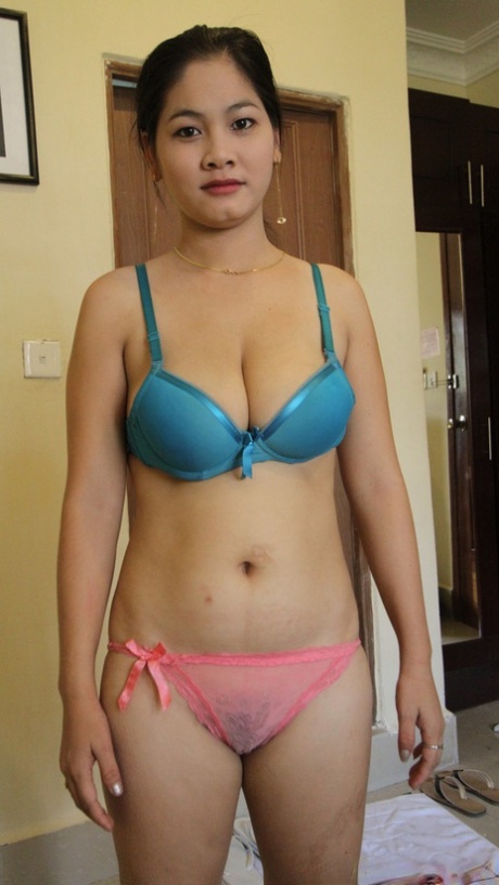 Chubby Thai girl Nga shows her big tits and spreads her legs for a cock