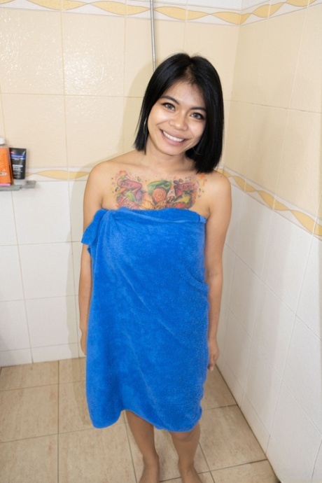 Asian babe Nani shows off her big boobs & shaves her pussy in the bathroom