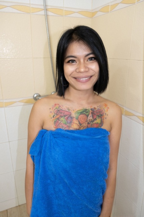 Asian babe Nani shows off her big boobs & shaves her pussy in the bathroom
