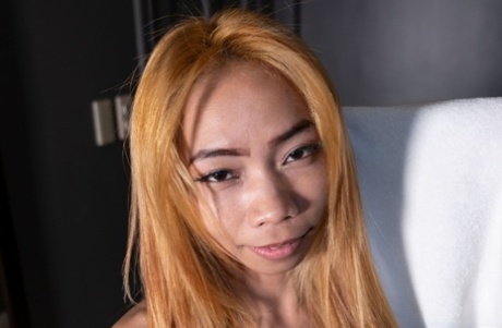 Asian babe Precious shows off her petite body in stockings & high heels