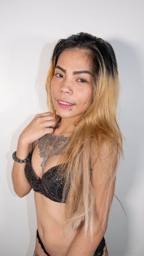 Tall tattooed Asian teen Jasmine strips her sexy lingerie and poses