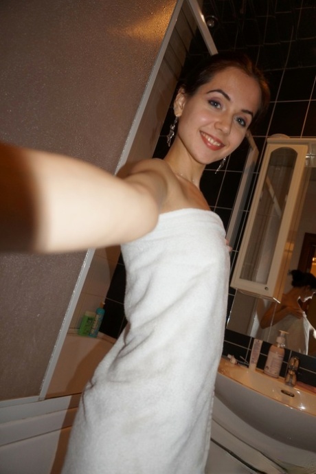 Cute brunette nerdy teen reveals her small tits and shaved cunt at home