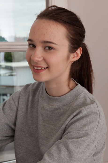 Amateur teen Julia Moore unveils her hairy muff and stretches it