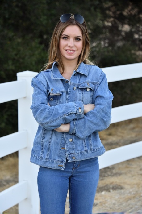 Sexy babe Summer shows her tiny tits while teasing in a jeans outfit outdoors