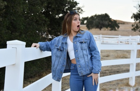 Sexy babe Summer shows her tiny tits while teasing in a jeans outfit outdoors