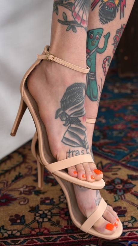 Tattooed babe Rocky Emerson shows off her stunning body in a sexy striptease
