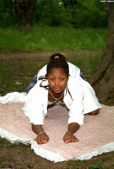 Pretty ebony schoolgirl Lorna shows her tits & her trimmed pussy outdoors