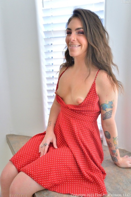 Brunette MILF amateur Thalia drops her book and exposes her cunt in a solo