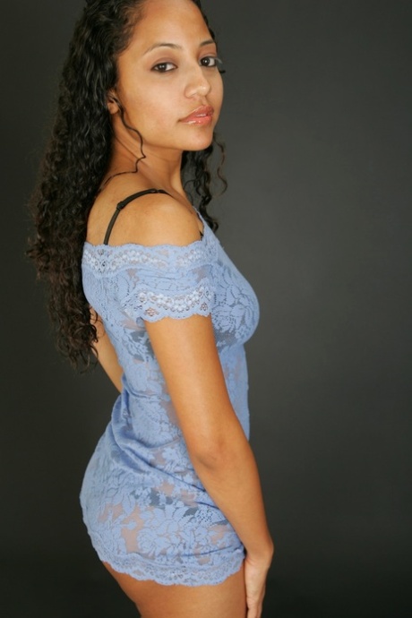 Pretty Mexican MILF posing in a sexy sheer dress and lingerie in a solo