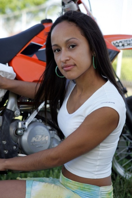 Breathtaking Latina Pamy posing for outdoors for a motorcycle magazine