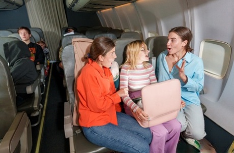 Naughty teens with delicious asses undress and play naked on an airplane
