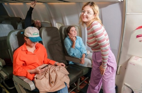 Naughty teens with delicious asses undress and play naked on an airplane