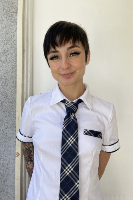 Brunette schoolgirl Stevie Moon spreads her shaved puffy pussy up close