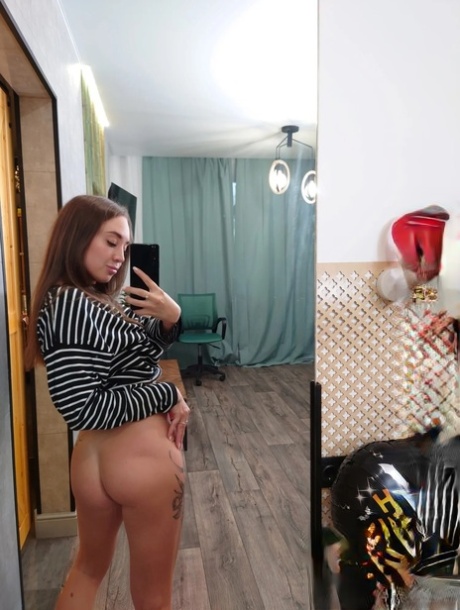 Skinny tattooed teen exposes her hot ass & pussy to take selfies in the mirror