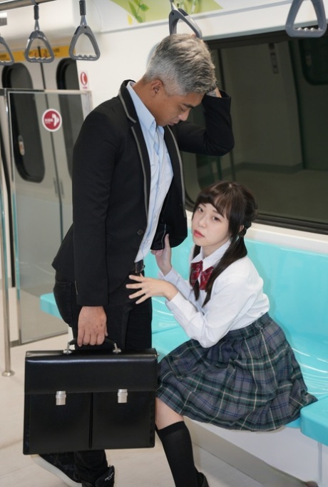 Asian schoolgirl Yuli has doggystyle sex with a senior on the train