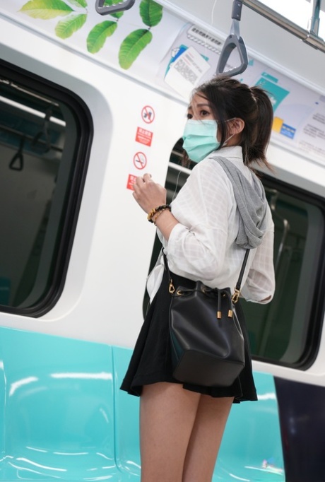 Asian schoolgirl Yuli has doggystyle sex with a senior on the train