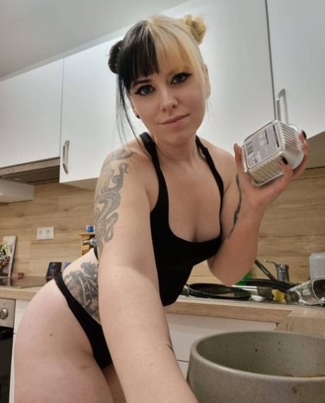 Hot amateur babe Kirajameson shows off her curves while cooking in the kitchen