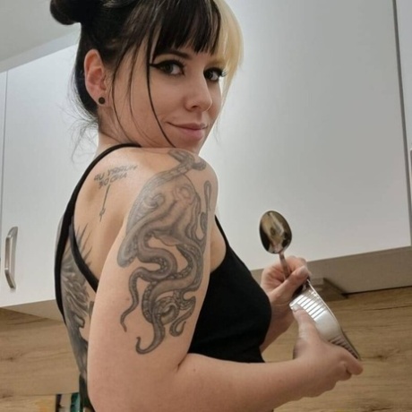 Hot amateur babe Kirajameson shows off her curves while cooking in the kitchen