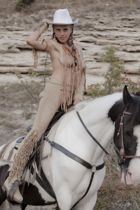 Sexy blonde cowgirl babe teases with her hot love holes outdoors