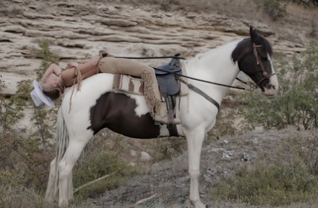 Sexy blonde cowgirl babe teases with her hot love holes outdoors