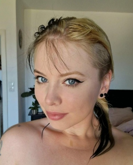 Amateur beauty Kirajameson makes silly faces while posing on camera