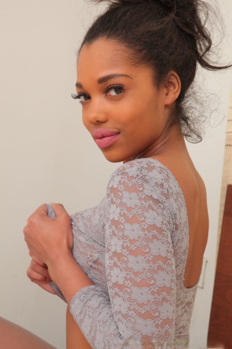 Very hot ebony babe Rehea shows her nice natural tits and poses in nylons
