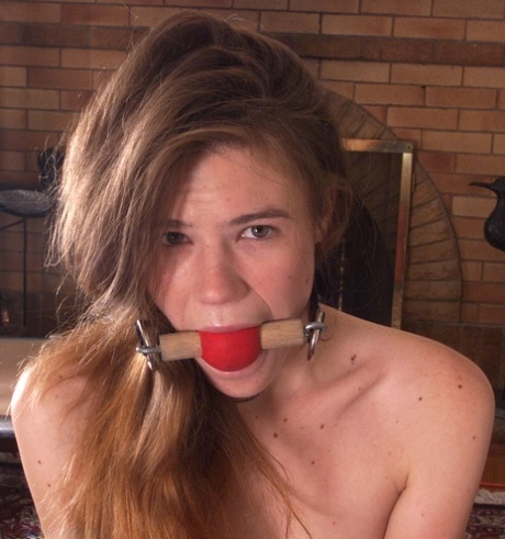 Submissive babe Ashley gets her big ass whipped while bound & ball-gagged