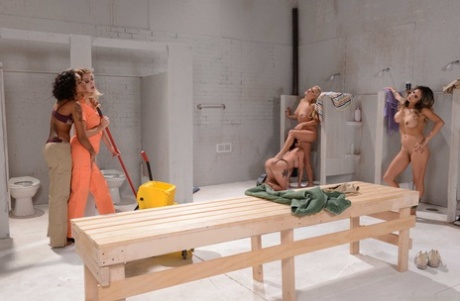 Sexy lesbian inmates get involved in a wild orgy in the bathroom