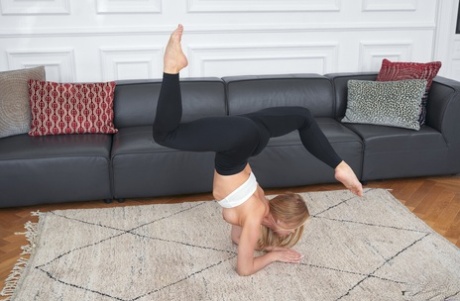 Flexible teen Calibri fingers her shaved pussy after a sexy striptease