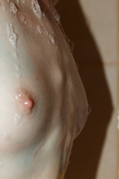 Pretty artist Kristina Proxy plays with her paints while totally naked