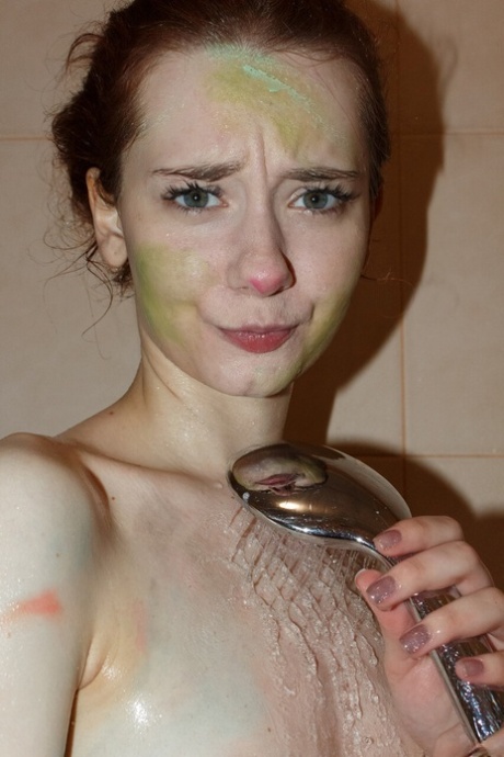 Pretty artist Kristina Proxy plays with her paints while totally naked