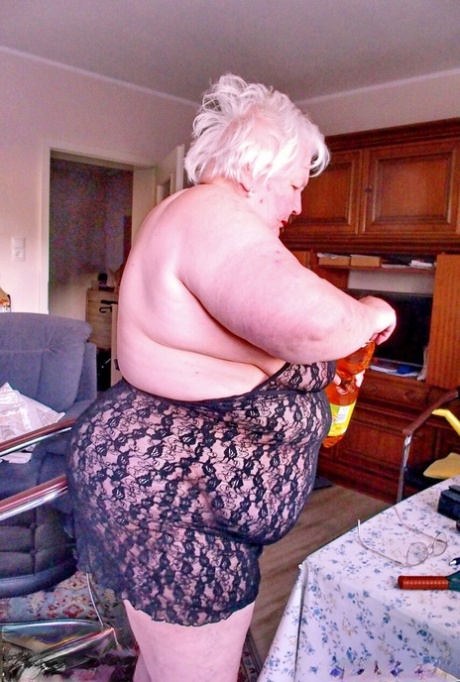 Chubby granny Marie Theres shows her big saggy tits & ass while changing
