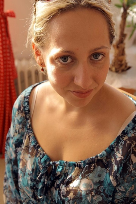 Natural blonde Mira gets dressed to wrap up a nude modelling session