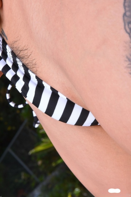 Attractive Asian girl with tattoos Saya Song presents her trimmed muff