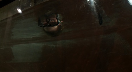 Blonde Rain DeGrey gets fucked by a machine dildo in underwater BDSM action